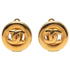 Boucles d'oreilles rondes clip en or plaqué CC doré Chanel Doré