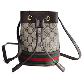 Gucci Bolsa bucket mini Ophidia GG em lona bege Marrom