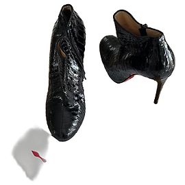 Christian Louboutin Botines Louboutin de cuero de pitón negro Negro