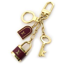 Chaveiro em forma de bolsa Hermès Dourado Bordeaux