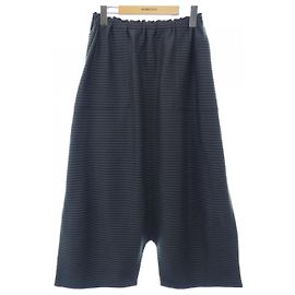 Pantalones ISSEY MIYAKE Castaño Gris