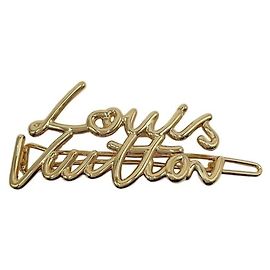 Fermaglio in metallo dorato Louis Vuitton D'oro