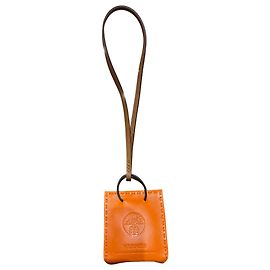 Hermès Mini charme Laranja Hermes em couro laranja e marrom Outro