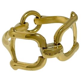 Céline Pulseira de metal dourado com detalhe de ferradura Celine Outro