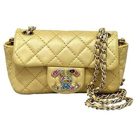 Bolsa flap extra mini em couro de cordeiro amarelo iridescente Chanel, usada Outro