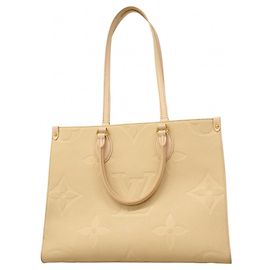 Borsa tote OnTheGo MM in Monogram Empreinte di Louis Vuitton Crudo