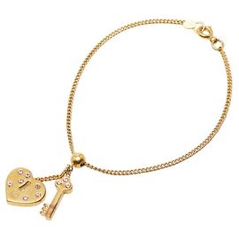 Pulsera de llave en forma de corazón con el logo Coco de Chanel Dorado