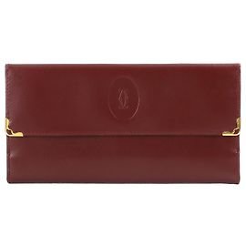 Cartera larga plegable Cartier Must Line Burdeos