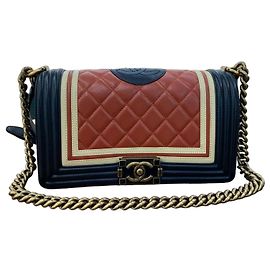 Chanel Bolsa Boy em couro de cordeiro laranja - Série Point Preto