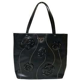 Bolsa de couro com logotipo de triângulo Prada e motivo floral Preto