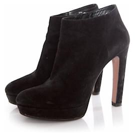 Prada, black suede platform boots. Black