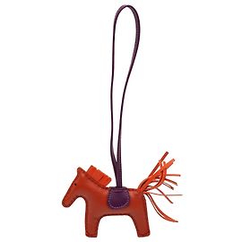 Charm para bolso Hermès Orange Milo Lambskin Grigri Rodeo PM Otro Naranja Púrpura