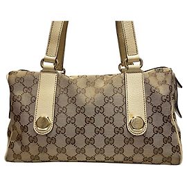 Bolsa Gucci em lona GG e couro Marrom