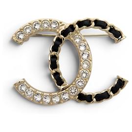NUOVO BROCHE CHANEL LOGO CC STRASS PELLE CATENA INTESTATA METALLO DORATO D'oro