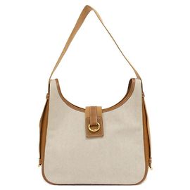 Bolsa Hermès Saco dourada de couro e tecido Dourado