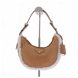 Prada Sac Arqué Small en cuir et shearling Marron