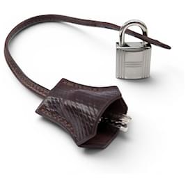 Hermès NUEVO CONJUNTO HERMES CANDADO + TIRADOR DE CREMALLERA CON CAMPANILLA PARA BOLSO KELLY Castaño