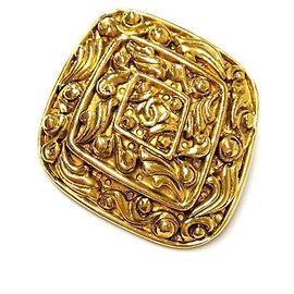 Spilla Chanel Vintage Coco Mark Arabesque D'oro