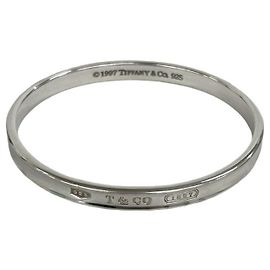 Tiffany & Co. Silver Logo Engraved Narrow Bangle Silvery