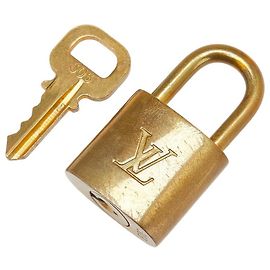 Set di lucchetto e chiave Louis Vuitton Accessorio D'oro Metallico