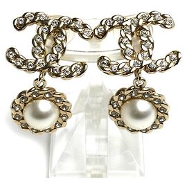 Orecchini a clip Chanel in metallo dorato e strass D'oro