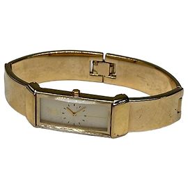 Yves Saint Laurent Montre bracelet vintage Saint Laurent avec logo, plaqué or, blanc Doré