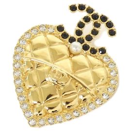 Spilla Chanel in nero, oro e bianco Nero Bianco D'oro