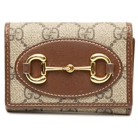 Cartera tríptico Gucci GG Supreme Horsebit Castaño