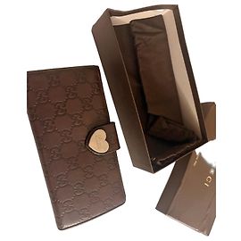 Gucci monogrammed brown leather wallet with heart clasp Brown