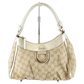 Sac à main Gucci Abbey en toile GG dorée Doré