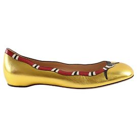 Gucci Sapatilhas douradas Dourado