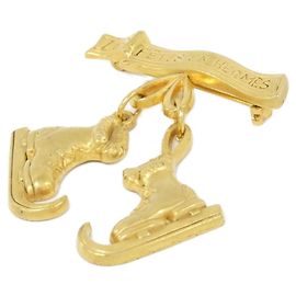 Broche Hermès dourado Dourado