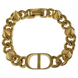 Pulsera con charms Christian Dior chapada en oro Dorado