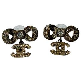 Boucles d'oreilles Chanel Crystal CC Bow Drop en métal doré Autre Imprimé python