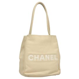 Tote Chanel Camellia de couro Bege