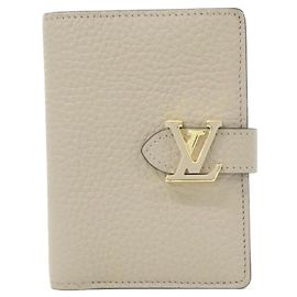 Cartera Compacta Louis Vuitton Taurillon LV Vertical Otro