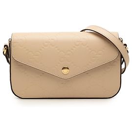 Pochette Gucci Bege Super Mini GG em couro com relevo Jumbo Bege