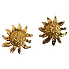Boucles d'oreilles clip soleil Yves Saint Laurent en métal doré Doré