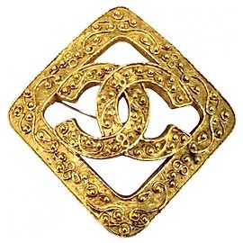 Broche Chanel dorée plaquée or Doré