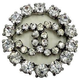 Broche redonda Chanel com strass Outro