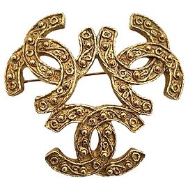 Broche Chanel Coco Mark Triple Coco Dorado