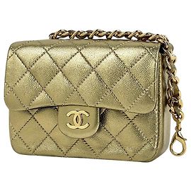 Charm per borsa Chanel in pelle dorata D'oro