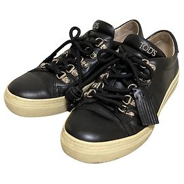 Sneakers con lacci e nappe in pelle Tod's Nero