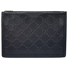 Gucci Clutch de couro com relevo GG Preto