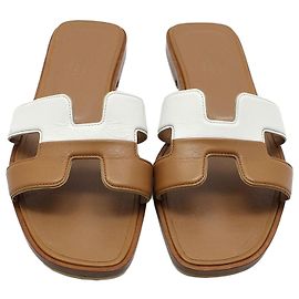Sandali Oran Hermès in pelle marrone e bianca Marrone