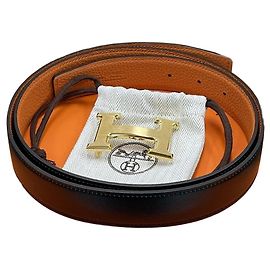 Hermès Cinturón reversible Negro/Oro mate Naranja Negro