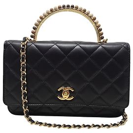 Chanel Mini bolsa tiracolo de corrente em pele de cordeiro com alça de mão preta Preto