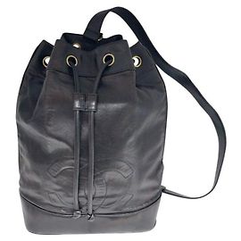 Chanel Black Lambskin CC Logo Drawstring Sling Bag Backpack Black