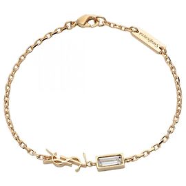Yves Saint Laurent Bracelet Cassandra de Saint Laurent Paris Doré Métallisé