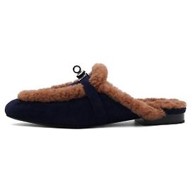 Hermès Mules e sandálias de camurça marine e shearling dourado Dourado